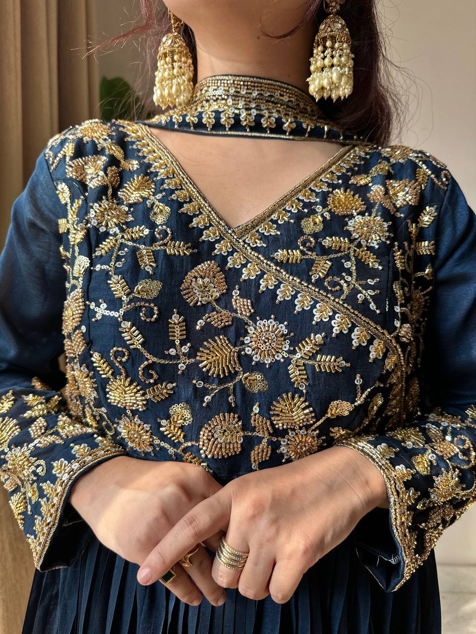 Navy blue traditional outfit with gold embroidery and jewelry
